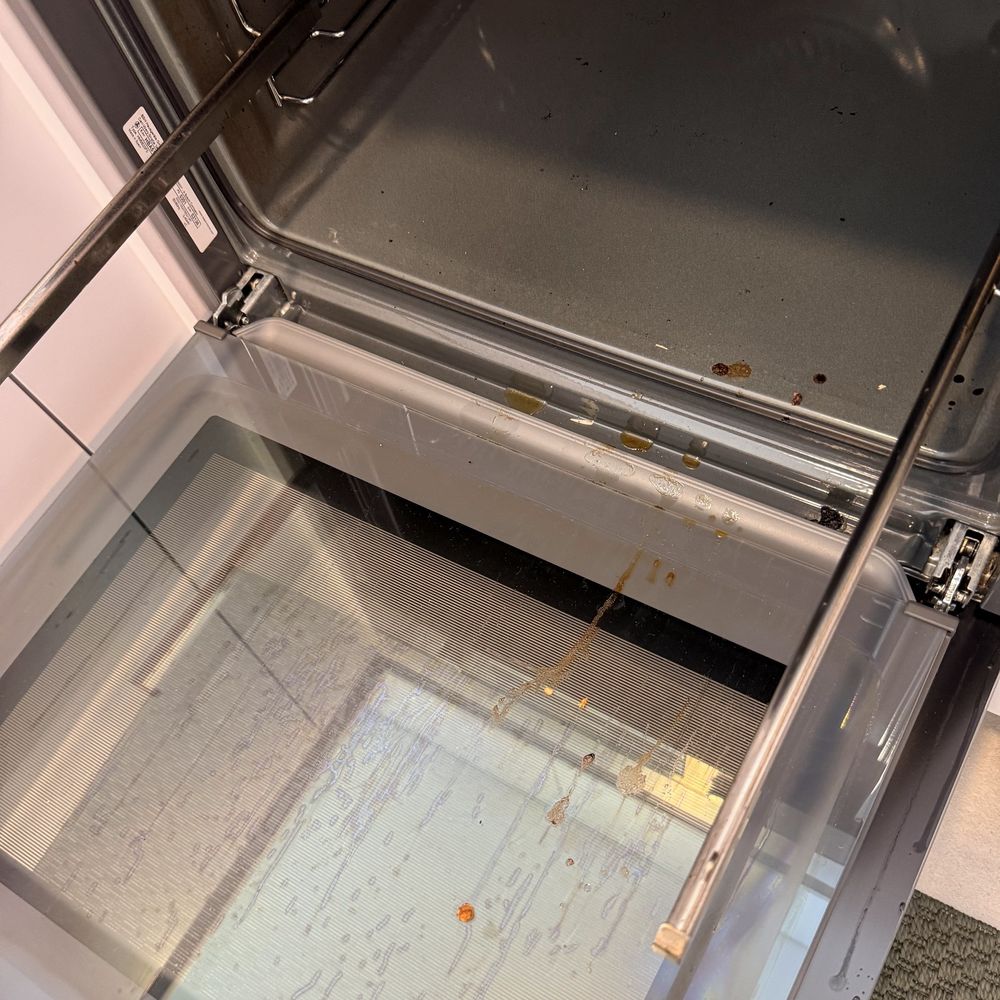 Oven door glass before cleaning
